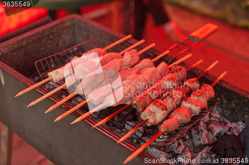 Image of Grilling marinated shashlik 