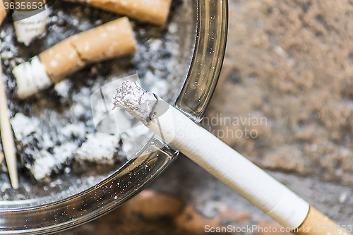 Image of Cigarettes on ashtray