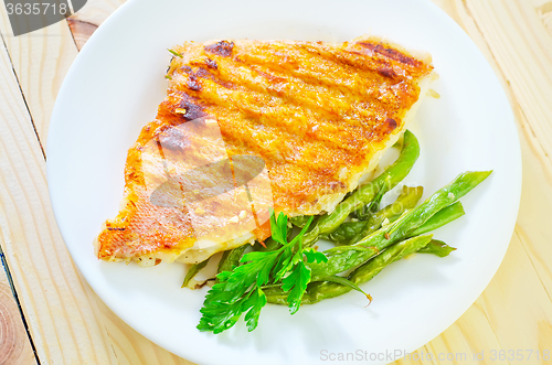 Image of fried fish with green beans