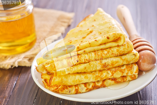 Image of pancakes with honey