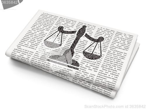 Image of Law concept: Scales on Newspaper background
