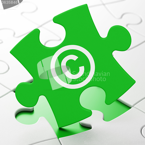 Image of Law concept: Copyright on puzzle background