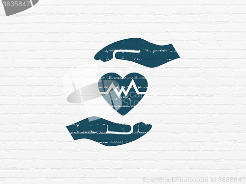 Image of Insurance concept: Heart And Palm on wall background