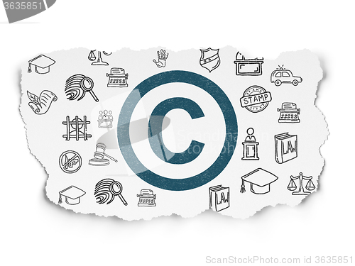 Image of Law concept: Copyright on Torn Paper background