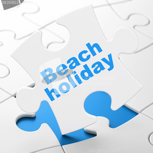 Image of Travel concept: Beach Holiday on puzzle background
