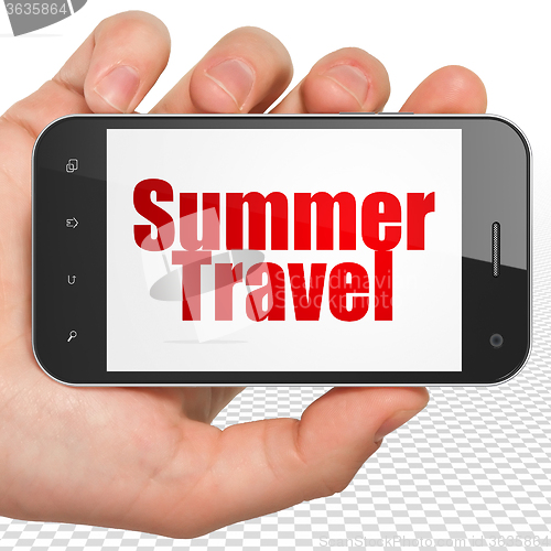 Image of Travel concept: Hand Holding Smartphone with Summer Travel on display