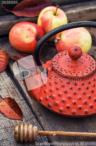 Image of Stylish kettle and an apple