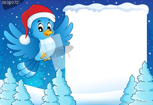 Image of Frame with bird in Christmas hat