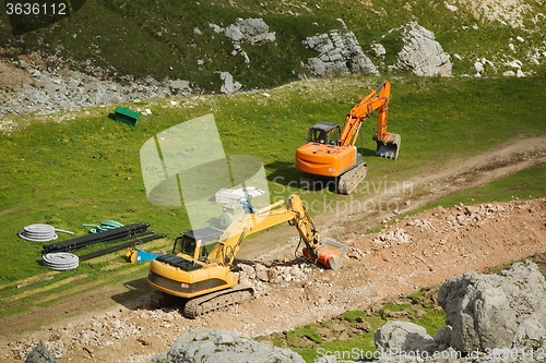 Image of Excavarors working on ski piste