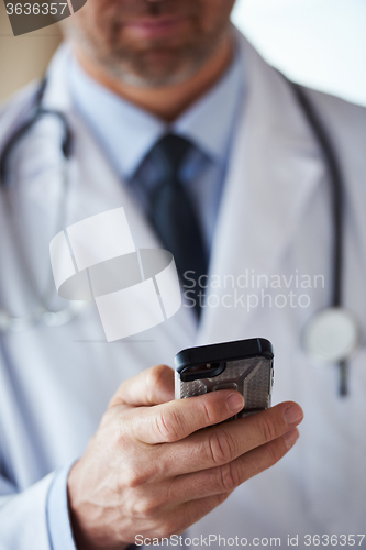 Image of doctor speaking on cellphone