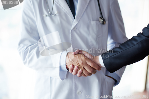 Image of doctor handshake with a patient