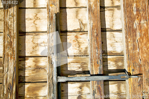Image of rusty  brown    morocco in africa  wood  facade and safe padlock