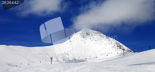 Image of Panoramic view on ski slope at sun wind day