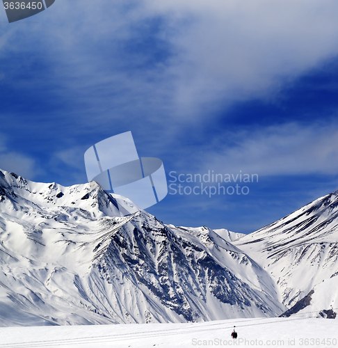 Image of Winter mountains and blue sky with clouds