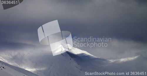 Image of Panoramic view on off-piste slope in storm clouds
