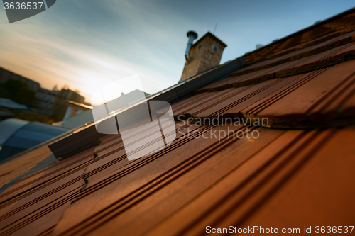 Image of Roof tile over blue sky