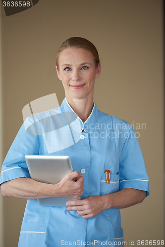 Image of female doctor with tablet computer