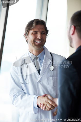 Image of doctor handshake with a patient