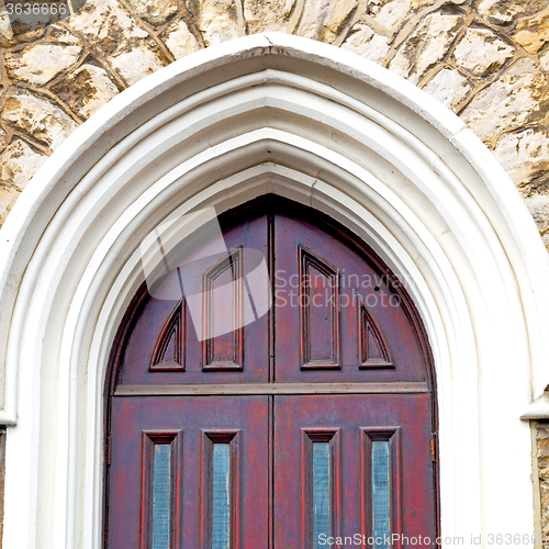 Image of brown wooden parliament in london old  door and marble antique  