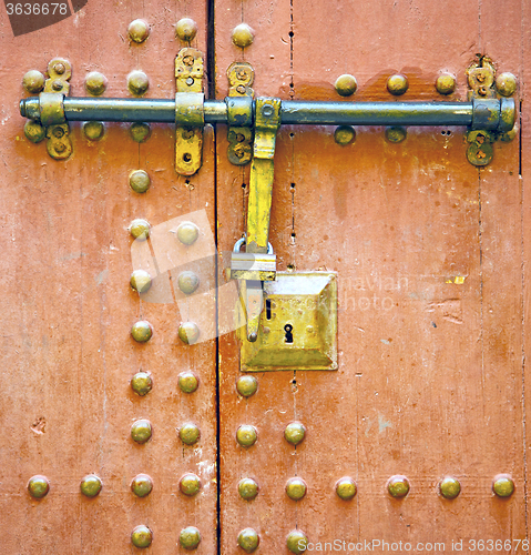 Image of rusty  brown    morocco in africa the old wood  facade home and 