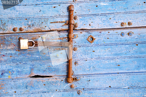 Image of rusty metal   nail dirty  and morocco  