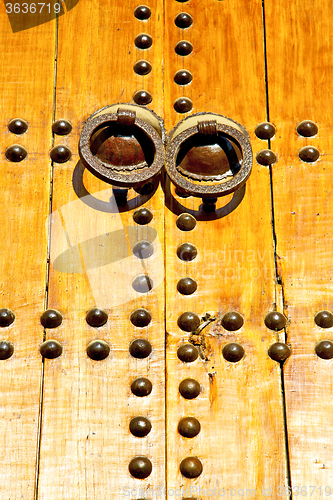 Image of rusty  brown    morocco in africa the old wood  facade 