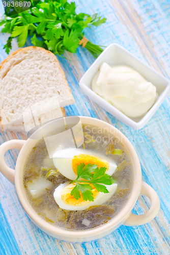 Image of green soup with boiled eggs
