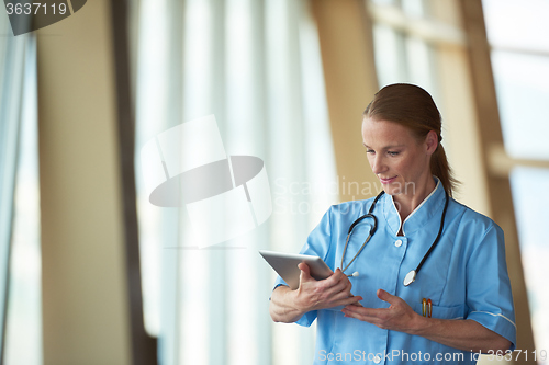 Image of female doctor with tablet computer