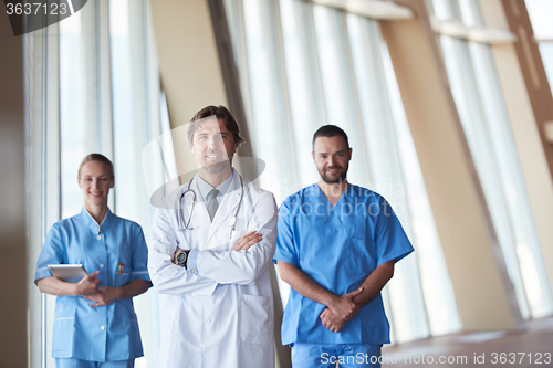 Image of group of medical staff at hospital, handsome doctor in front of 