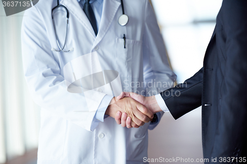Image of doctor handshake with a patient