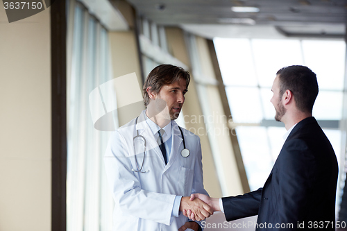 Image of doctor handshake with a patient