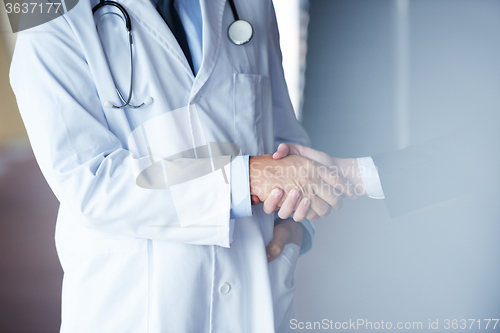 Image of doctor handshake with a patient