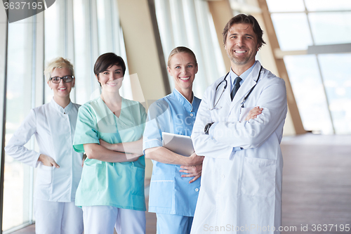 Image of group of medical staff at hospital, handsome doctor in front of 