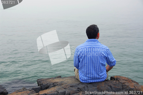 Image of Man looking at fog