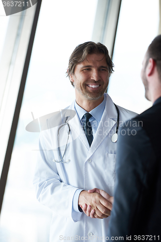 Image of doctor handshake with a patient