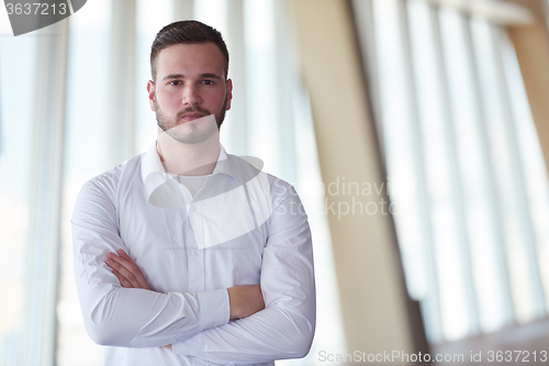 Image of business man with beard at modern office