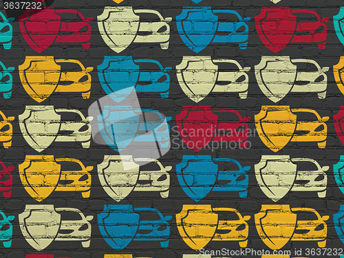 Image of Insurance concept: Car And Shield icons on wall background