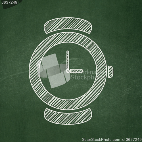 Image of Time concept: Hand Watch on chalkboard background