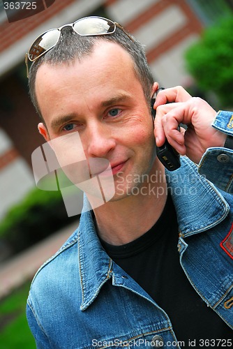 Image of Man talking on cell phone