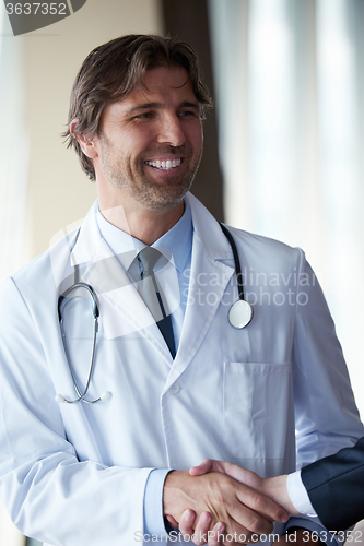 Image of doctor handshake with a patient