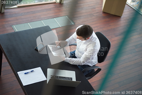 Image of top view of young business man at office