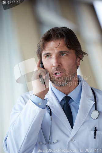 Image of doctor speaking on cellphone