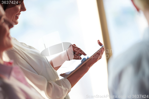 Image of business woman working on tablet computer