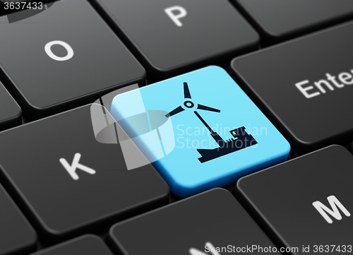 Image of Industry concept: Windmill on computer keyboard background