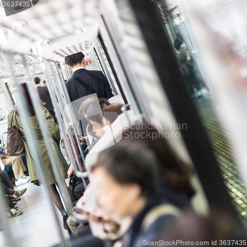 Image of Passengers traveling by Tokyo metro.