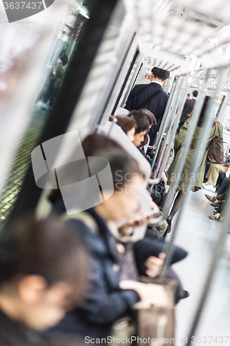 Image of Passengers traveling by Tokyo metro.