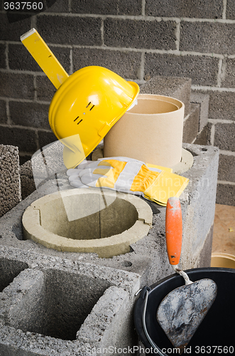 Image of Construction of modular ceramic chimney in the house