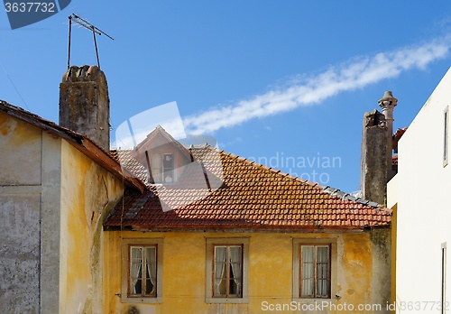 Image of An old house in Sintra, Portugal, with tile roof and garret