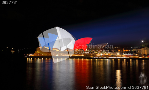 Image of Sydney Opera House lit up in French Flag Colours