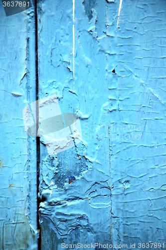 Image of dirty stripped paint in the   wood door and rusty  